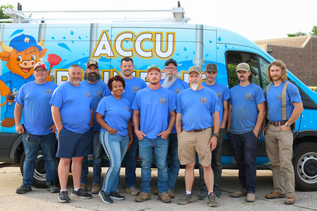 ACCU Plumbing team standing beside company service van in Blue Springs Missouri