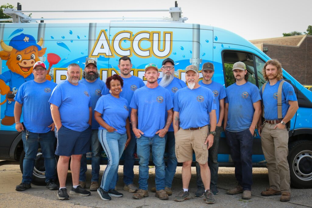 ACCU Plumbing residential plumber team standing beside service van