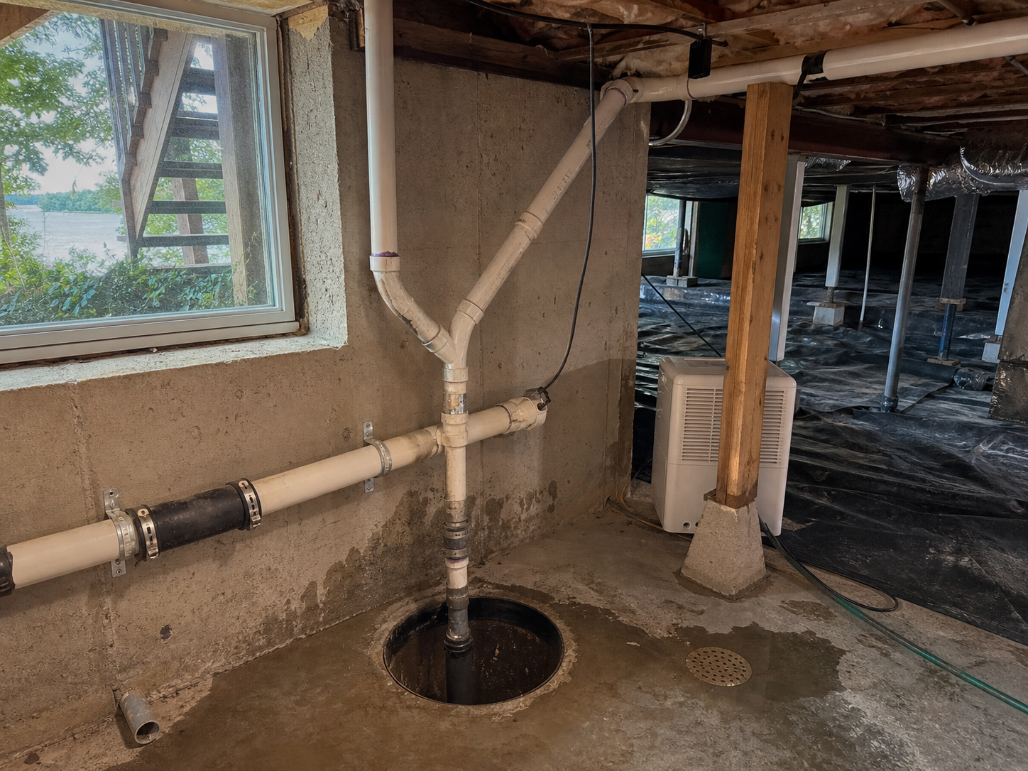 Lake home lower-level drainage and plumbing issue in Lake Tapawingo